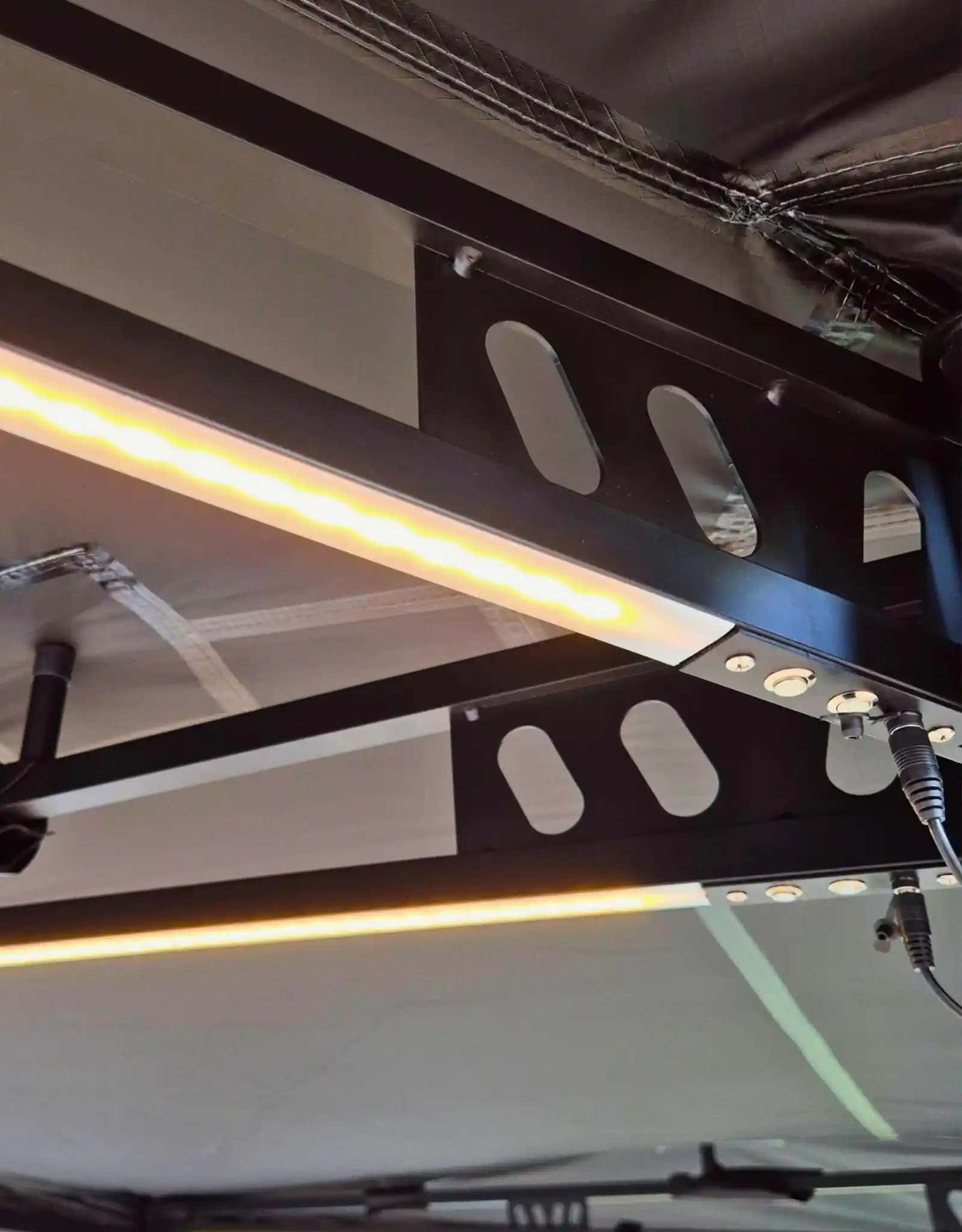 Firefly Outdoors 270° awning set up at an off-grid campsite
